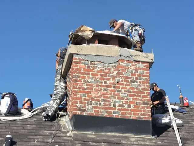 Glastonbury Chimney Sweep installing a custom chimney crown in Glastonbury, CT