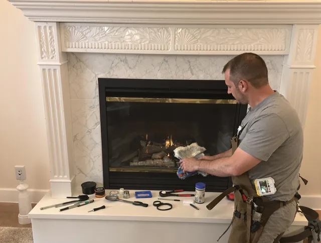 Glastonbury Chimney Sweep performing fireplace maintenance in Glastonbury, CT