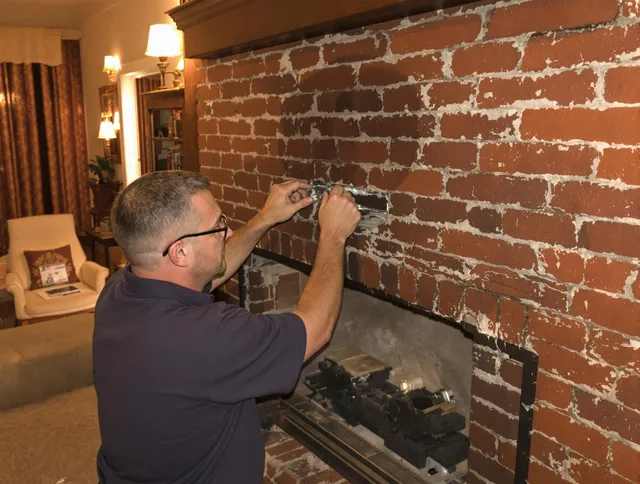 Glastonbury Chimney Sweep expert fixing a fireplace in Glastonbury, CT